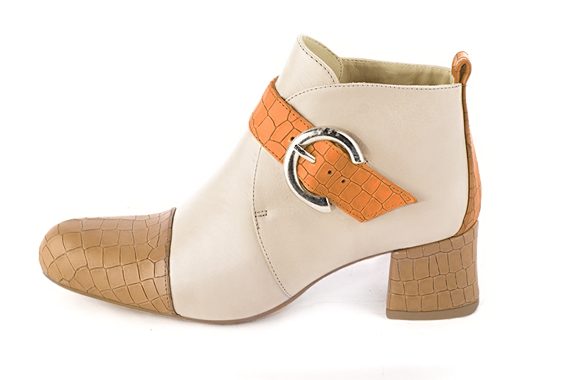 Camel beige, champagne white and marigold orange women's ankle boots with buckles at the front. Round toe. Low flare heels. Profile view - Florence KOOIJMAN